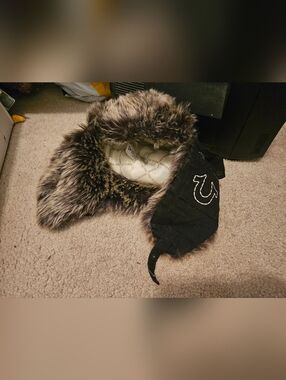True Religion Trapper Hat Faux Fur Horseshoe Pockets Used Condition 100% Cotton.